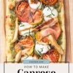 A caprese flatbread with sliced tomatoes, mozzarella, basil, and peas and carrots on a wooden background.