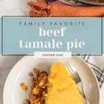 A slice of tamale pie with corn and ground beef sits on a white plate next to a baking dish on a white surface, accented by a beige napkin.