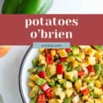 A bowl of diced potatoes mixed with red and green bell peppers and onions sits beside whole veggies. Text overlay reads "potatoes o'brien," highlighting this classic breakfast side.