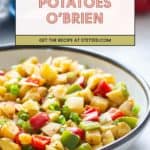 A bowl of classic Potatoes O'Brien with diced potatoes, red bell peppers, and green onions sits below a recipe label for this crowd-pleasing dish.