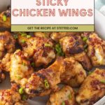 A bowl of sticky chicken wings, grilled to perfection and garnished with chopped green onions, features a recipe banner overlay at the top.