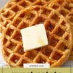 Three sweet potato waffles topped with a pat of butter on a white plate, with text overlay reading "sweet potato waffles"—a delicious twist on your breakfast favorite.