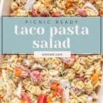 A dish of rotini pasta salad mixed with shredded chicken, grape tomatoes, and chopped bell peppers, labeled "Picnic Ready Taco Pasta Salad" for a flavorful taco pasta salad twist.