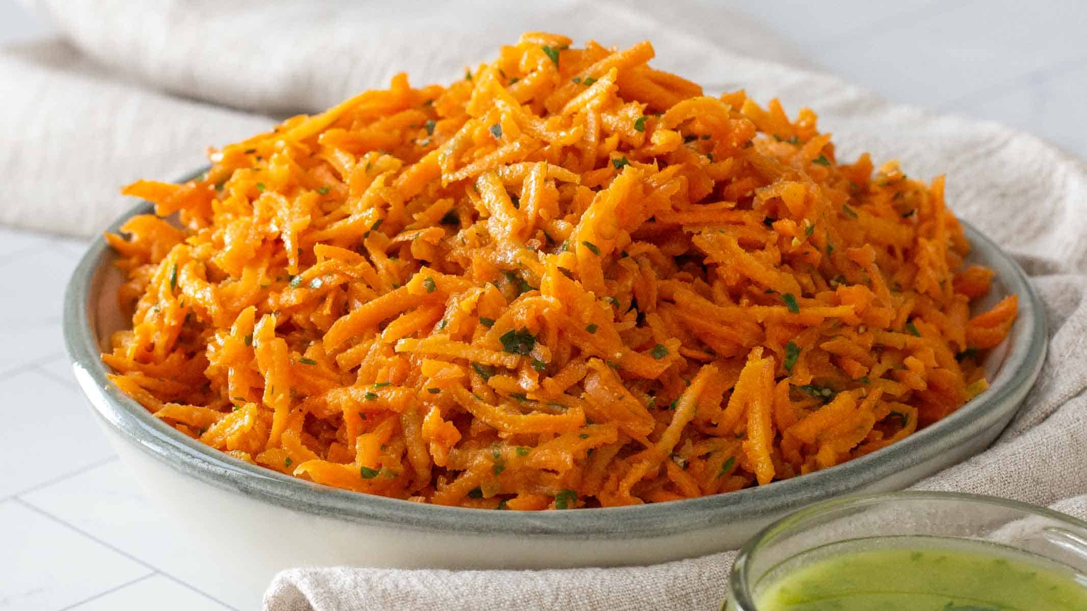 Shredded carrot salad dressed in a light lemon vinaigrette.