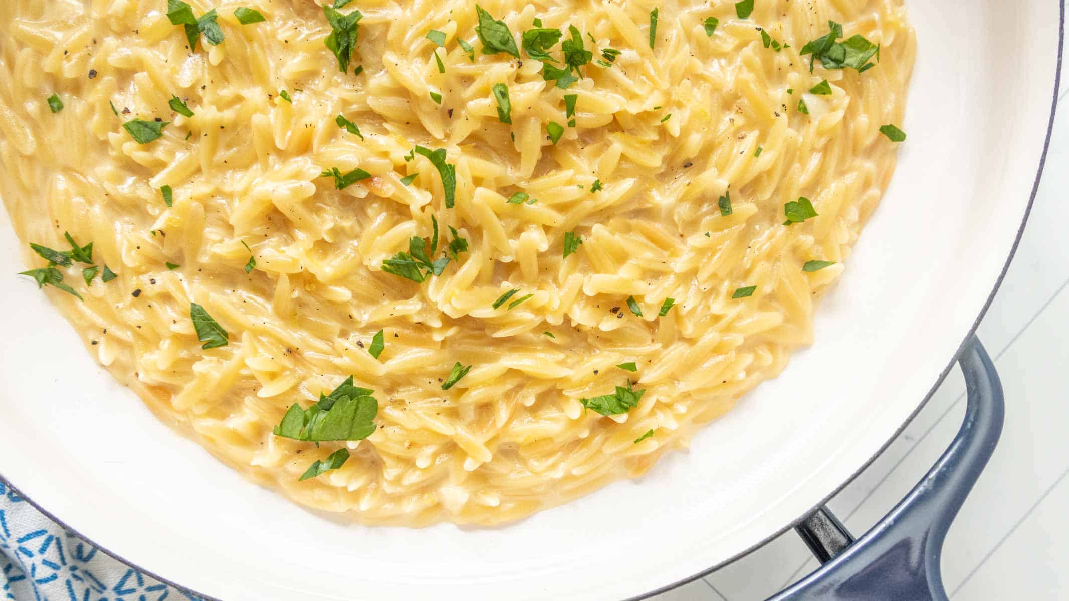 Creamy lemon orzo in a serving dish.