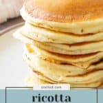 A stack of golden-brown ricotta pancakes on a plate, with text overlay reading “ricotta pancakes - best breakfast idea.”.