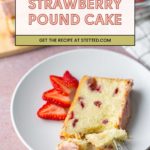 A slice of strawberry pound cake with sliced strawberries on a white plate, a fork, and more cake and strawberries in the background.