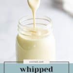 A spoon drizzles creamy, whipped honey into a glass jar; text overlay reads "whipped honey, creamy & fluffy.
