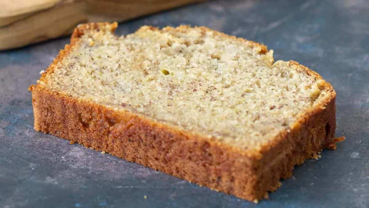 Slice of banana bread with other slices in the background.