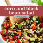 A bowl of corn and black bean salad with chopped tomatoes, red peppers, avocado, and cilantro, mixed with a wooden spoon.