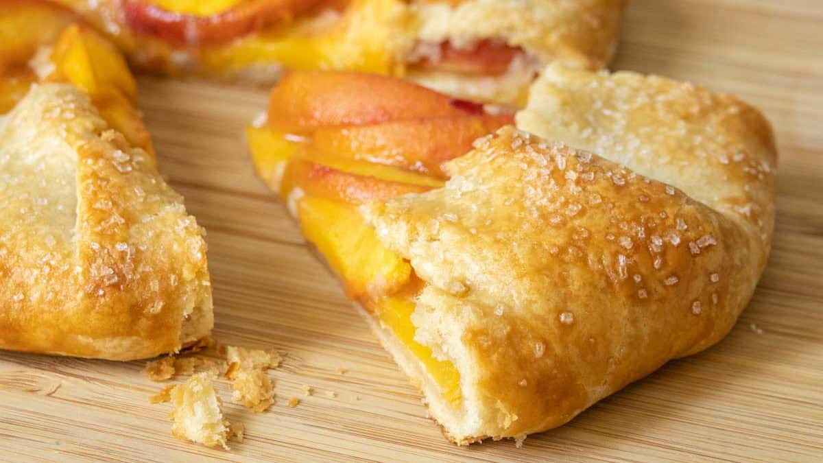 Peach galette with a slice pulled out.