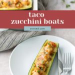 A plate with a stuffed zucchini boat filled with taco-seasoned meat and melted cheese, next to a fork and knife; more zucchini boats are in a baking dish nearby.
