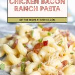 A plate of creamy chicken bacon ranch pasta garnished with chopped green onions, with a recipe banner at the top.