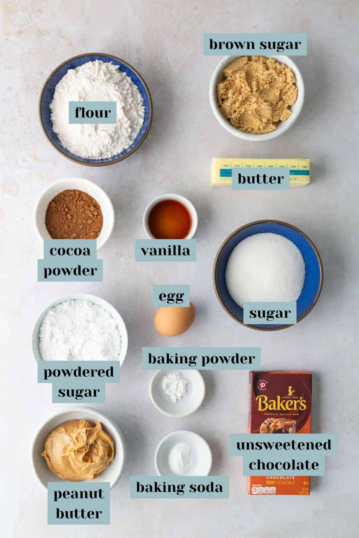 Baking ingredients including flour, brown sugar, butter, cocoa powder, vanilla, sugar, powdered sugar, egg, baking powder, peanut butter, baking soda, and unsweetened chocolate.