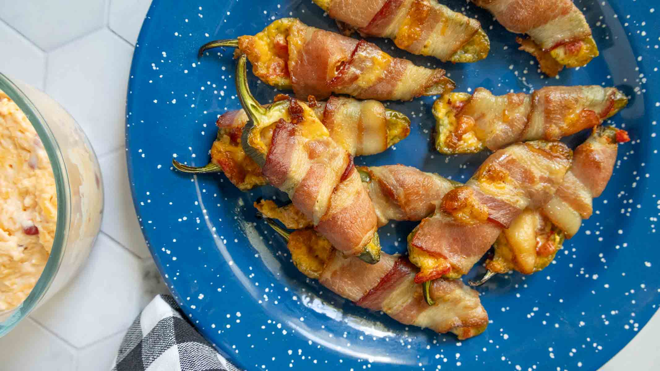 Jalapeños stuffed with pimiento cheese and baked until bubbly.