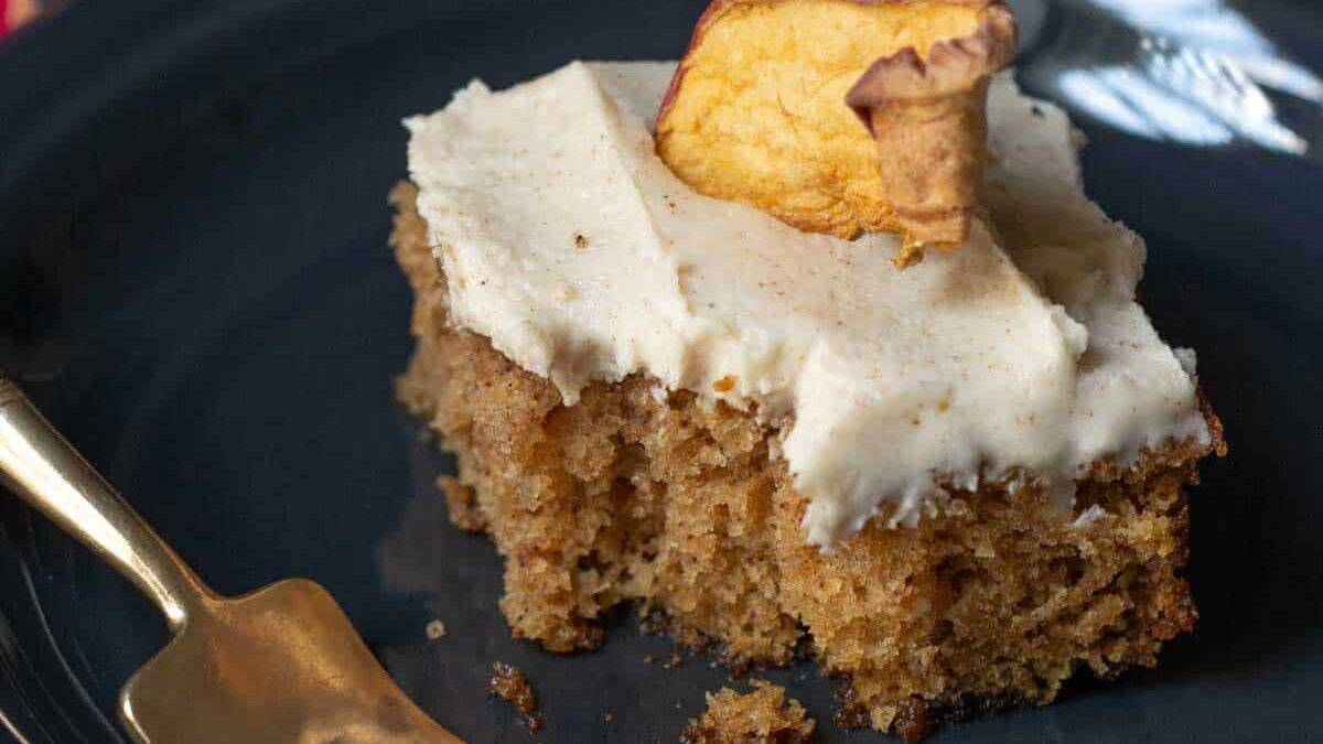 slice of apple spice cake with a bite taken out