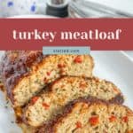 Three slices of turkey meatloaf with visible red peppers are served on a white plate, with plates and a pepper grinder blurred in the background. Text overlay reads "turkey meatloaf.