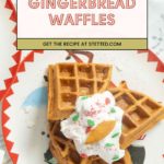 A plate with gingerbread waffles topped with whipped cream and festive sprinkles, shown beneath a sign reading โGingerbread Waffles. Get the recipe at stetted.com.โ.