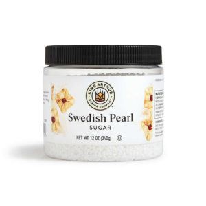 A clear plastic jar labeled "Swedish Pearl Sugar" from King Arthur Baking Company, containing 12 oz (340g) of white sugar pearls.