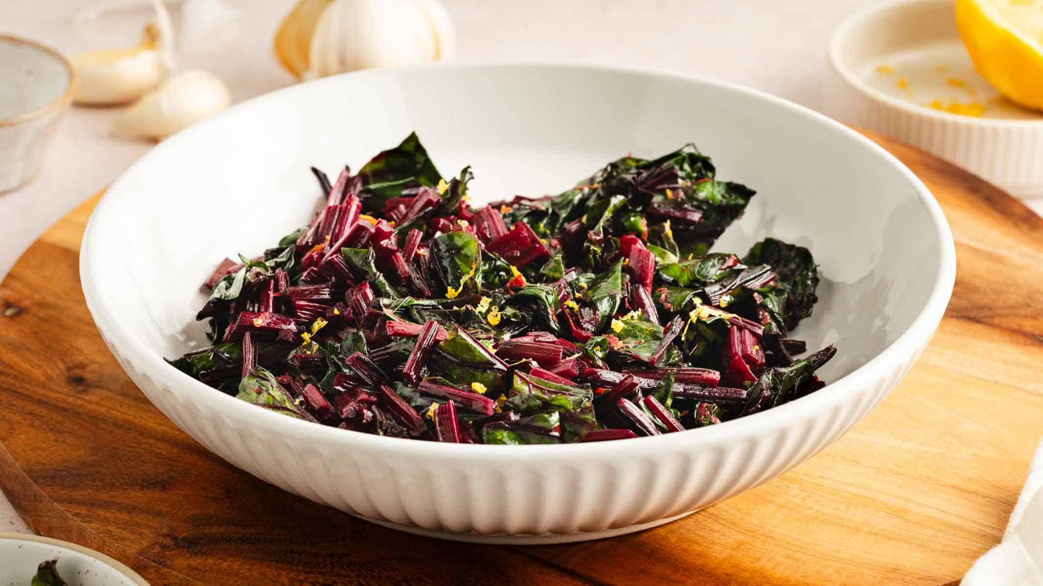 Cooked beet greens in pan.