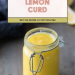 A glass jar filled with lemon curd sits on a table beside a spoon. Text above reads “Lemon Curd – Get the recipe at stetted.com.”.
