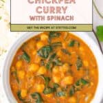 Bowl of chickpea curry with spinach in a rich orange sauce, served next to a portion of rice. Text overlay reads "Chickpea Curry with Spinach. Get the recipe at stetted.com.