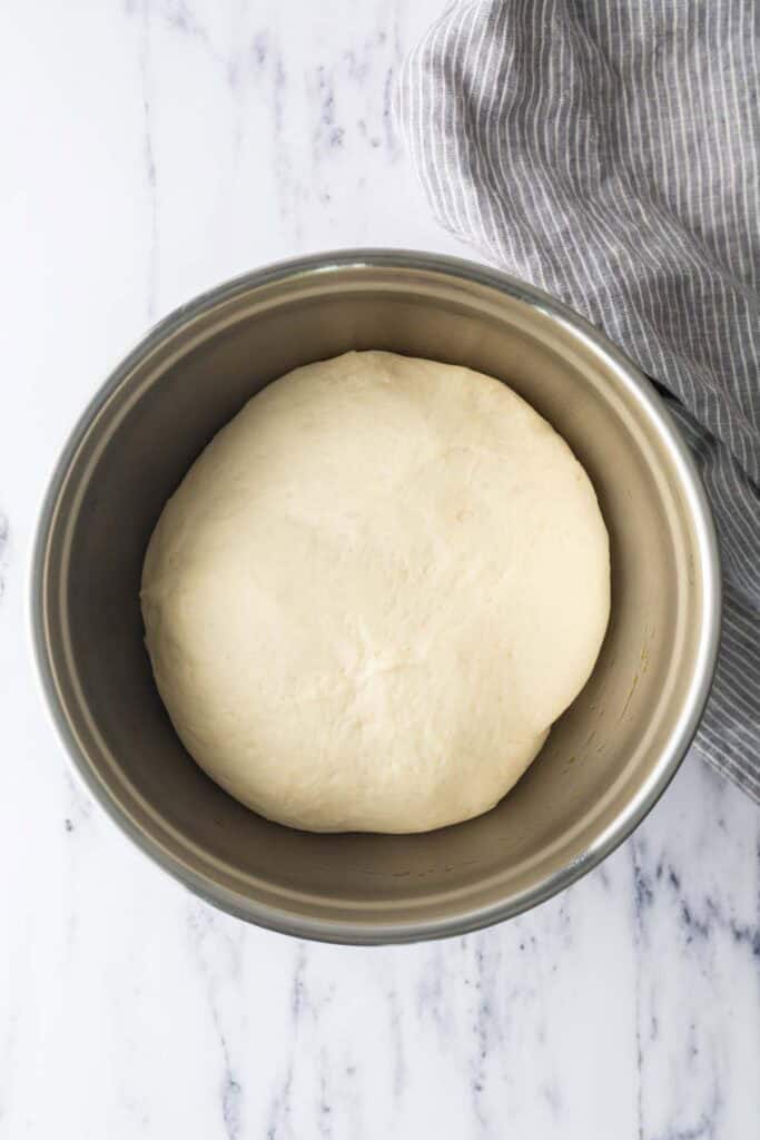 A bowl of risen dough.